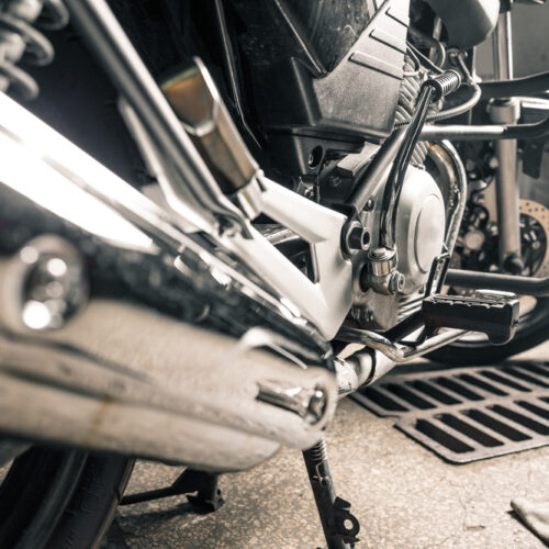 Young,Man,In,Leather,Jacket,Fixing,Motorcycle